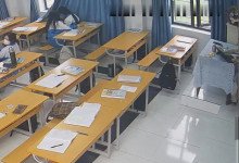 The teacher dangling shoeplay and dipping many times during class 5