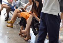 Girl in low-cut liners socks dangling