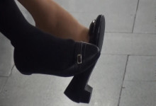 Black and white nylon feet dangling on chair