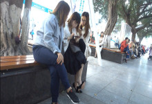 Lady dangling and shoeplay when play iphone