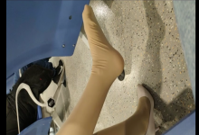 Bare and nylon feet dangling shoeplay from waitting room