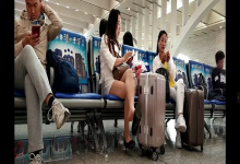 Lady great dangling shoeplay when waiting for the train in railway station lounge 2 Lady great dangling shoeplay when waiting for the train in railway station lounge 2