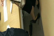 The doctor dangling shoeplay under the table when treating the patient