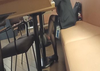 The lady in black nylon dangling shoeplay when having lunch 4