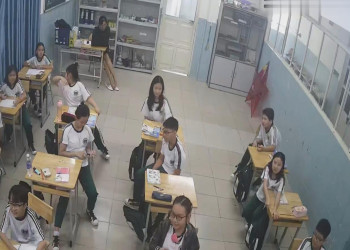 The teacher dangling shoeplay when sitting at the back of the classroom