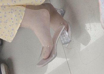 The lady in white heels dangling shoeplay when waiting for a call 8