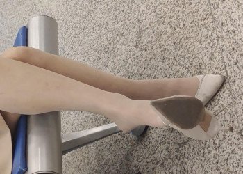 The lady in white heels dangling shoeplay when waiting for a call 10