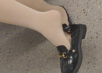 The lady in white heels dangling shoeplay when waiting for a call 16