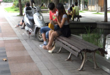 Girl relax her tired nylon feet when talking with her bf