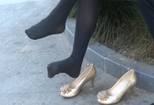 Black nylon feet dangling and shoeplay