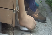 A pair of sexy white nylon feet in the park