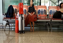 Lady remove shoe and relax her tired feet when waiting for a train 40