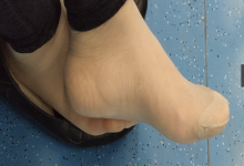 The girl remove shoes relax her tired feet when waitting for a train 16