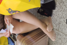The lady remove shoes relax her tired feet when waitting for a train 26
