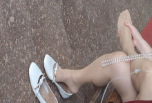 The middle age lady's remove heels massage her feet by herself