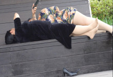 The lady remove heels lie in the chair 