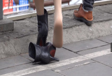 The middle-age lady remove boots show us her sexy nylon feet