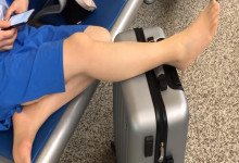 The lady remove shoes relax her tired feet when waitting for a train 37