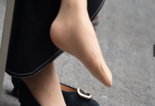 The middle-age lady relax her sexy tired feet on the chair 13