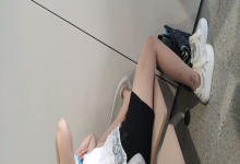 The girl remove her sneaker relax her feet