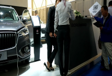 Car salesgirl stand up dipping shoeplay