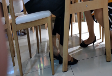 The lady dipping shoeplay under the table when having lunch 5