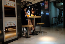The lady dipping shoeplay under the table when having lunch 8