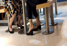 The lady dipping shoeplay under the table when having lunch 12