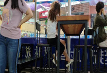 The lady dangling shoeplay under the table when having lunch 23