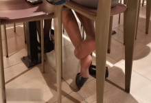 The lady dipping shoeplay under the table when having lunch 24