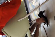 The middle-age lady sit down dipping and shoeplay under the table
