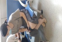 The  lady dangling shoeplay when line up in the waiting hall 121