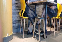 The girls dangling shoeplay under the table when having lunch 7