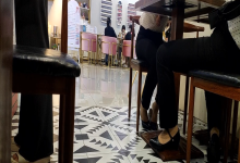 The girl dangling shoeplay under the table when having lunch 20