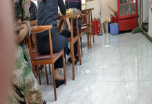 The girl dangling shoeplay under the table when having lunch 23