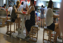 The girl dangling shoeplay under the table when having lunch 30