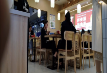 The girl dangling shoeplay when having lunch