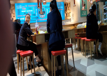 The hostess dangling under the table when having lunch