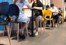 The hot girl dipping shoeplay under the table when having lunch