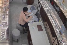 The jewelry store hostess in black nylon heelpopping under the table