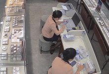 The jewelry store hostess in black nylon  dipping shoeplay under the table 2