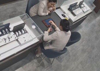 The jewelry store hostess in white dress and white heels sit down shoeplay 10