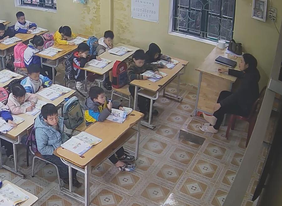 The teacher in white nylon relaxes his feet during class