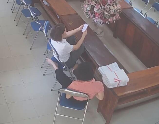 The teachers remove heels relax her tired feet after class 6