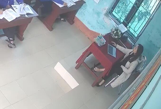 The teacher dangling heels with her toes 1