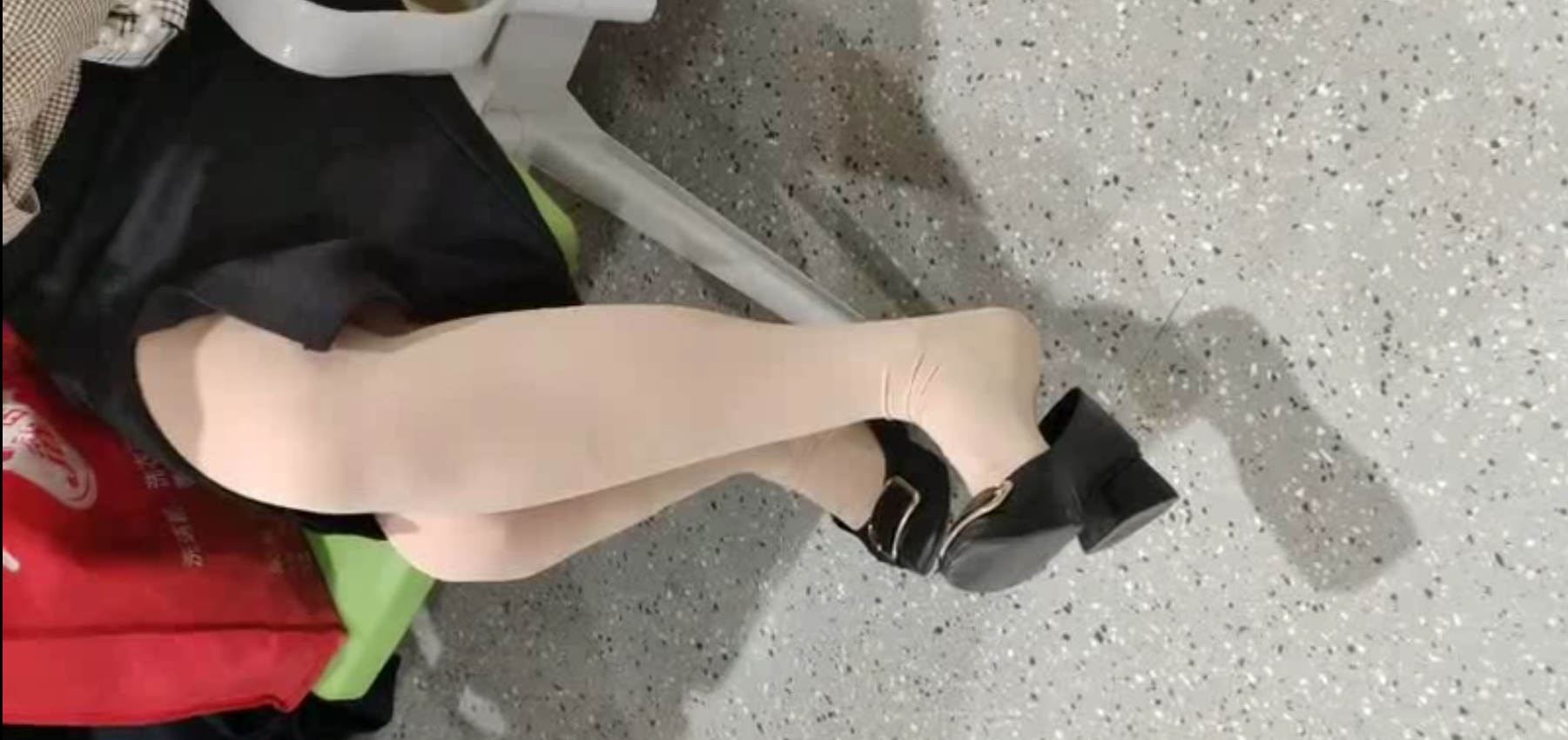 Lady dangling shoeplay when line up in the waiting hall 45