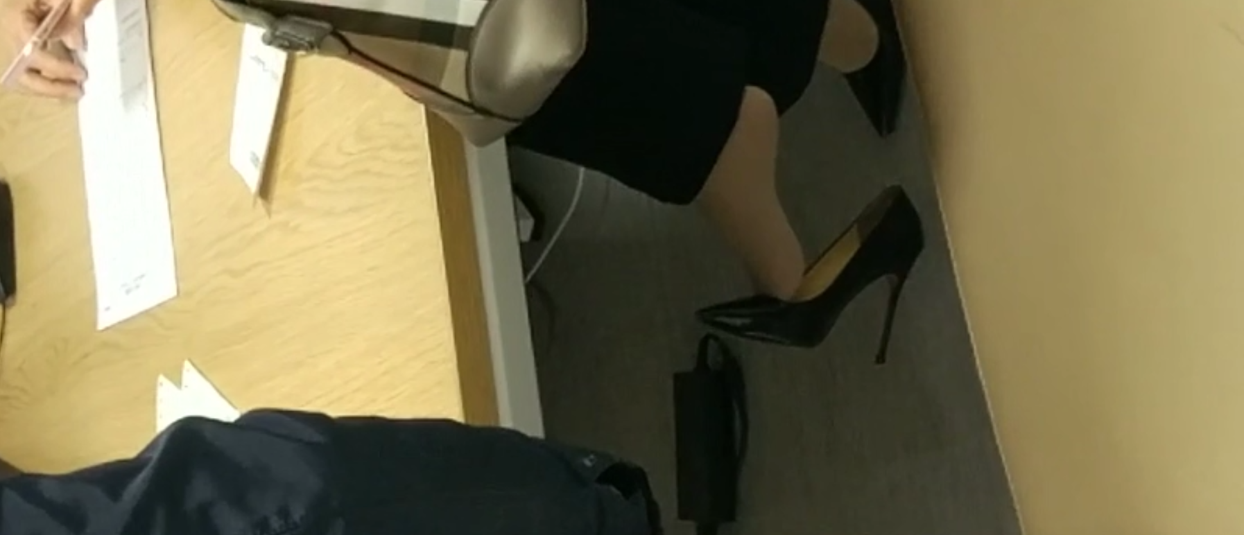 The doctor dangling shoeplay under the table when treating the patient