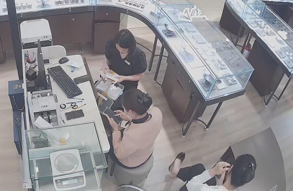 The jewelry store hostess bare feet dangling