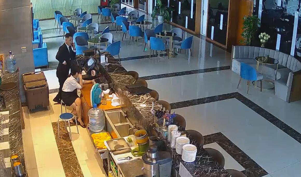 The hotel receptionist dangling shoeplay
