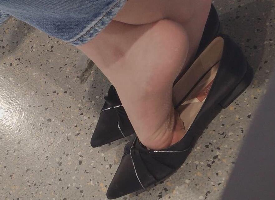 The lady in black heels dangling shoeplay when waiting for a call 6